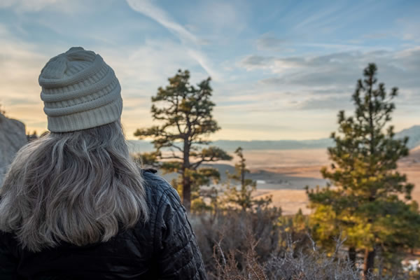Woman looking off into wilderness
